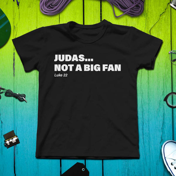 Judas... Not a Big Fan Christian Tshirt o a colored background