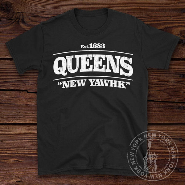Queens New York Tee shown on a wooden background